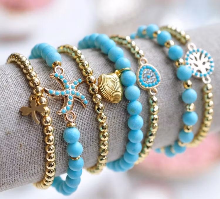 Ljust guldfärgad turkos connector sjöstjärna, 1 st