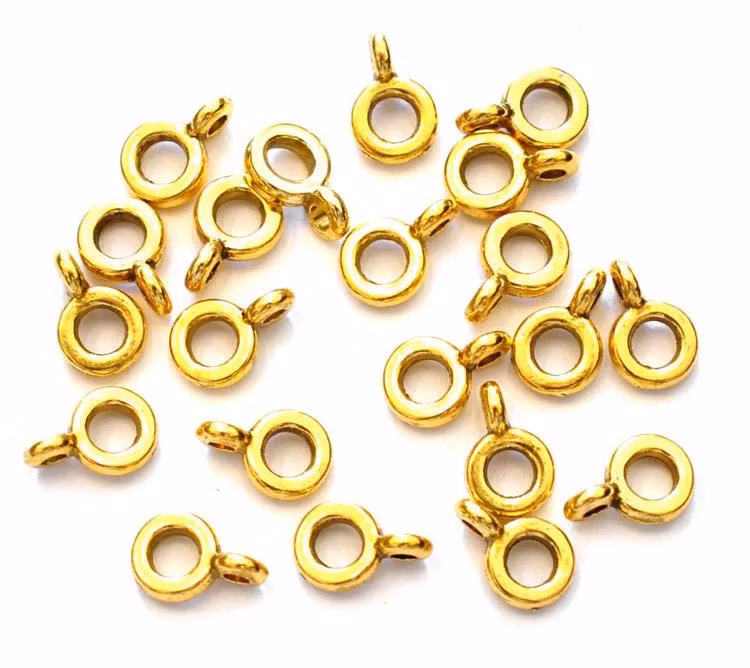 Antikt guldfärgade hangers smala, ca 50 st