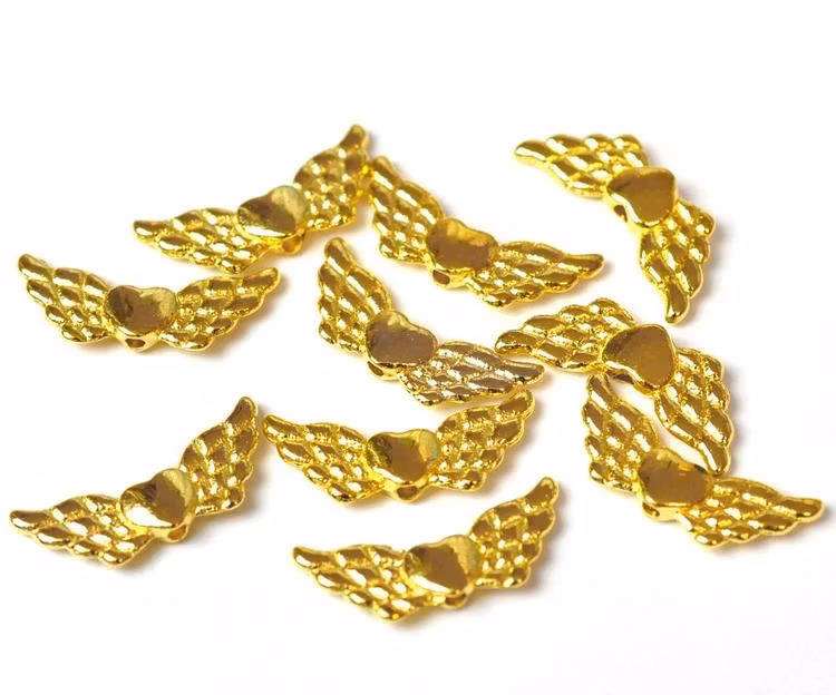 Guldfärgade änglavingar med hjärta, ca 100 st