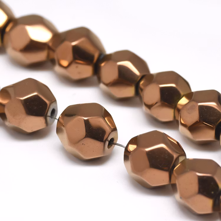 REA: Kopparfärgad hematit facetterade 9-10 mm, 10 st