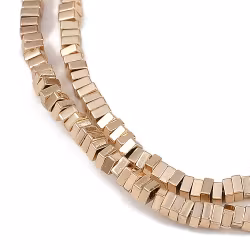 REA: Ljust guld/roséfärgad hematit fyrkanter 2 mm, 1 sträng