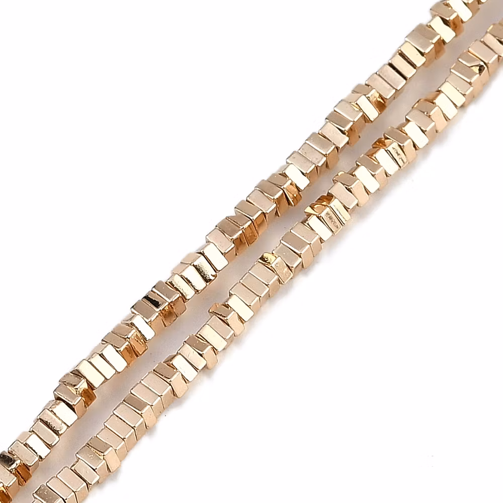 REA: Ljust guld/roséfärgad hematit fyrkanter 2 mm, 1 sträng