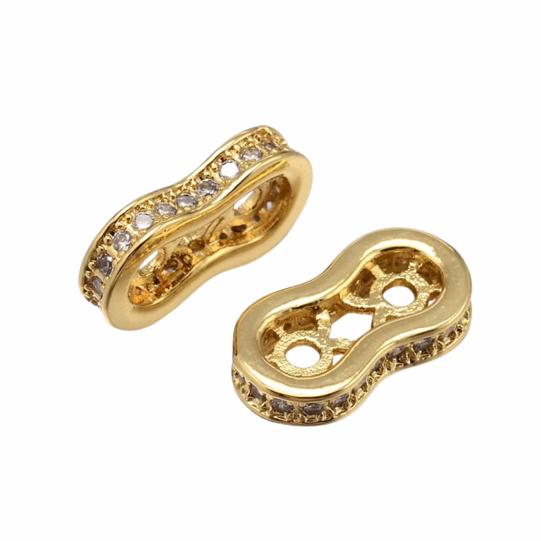Guldfärgad mellandel med 2 hål och  cubic zirconia, 1 st