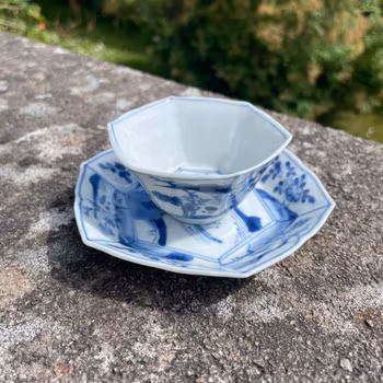 A BLUE AND WHITE HEXAGONAL CUP AND SAUCER, Transition / Kangxi period #2006