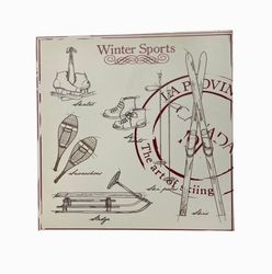 Winter sports M en fyrkantig plåtburk från Svanefors, mått h 15 x b 15 x h 7 cm.