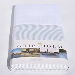 Pauline ett vit och grönrandigt påslakan från Gripsholm till spjälsäng i 100% bomull.