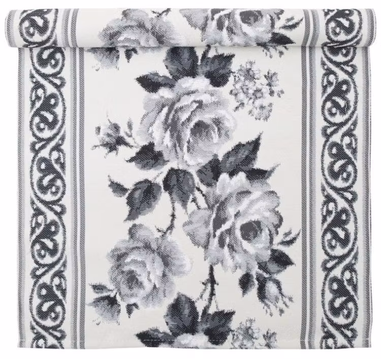 Rose är en vackert vävd löpare. Färg: Off-white och svart. Mått: 35 x 70 cm.
