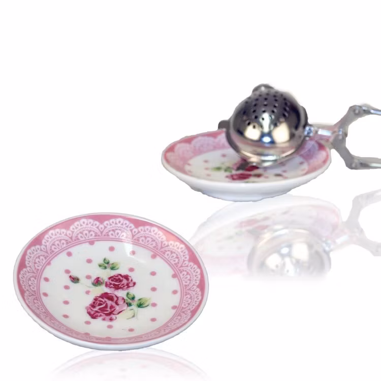 78927 en miniassiett i stengods. Färg: Vit med en rosa bård och ett vackert blommönster.