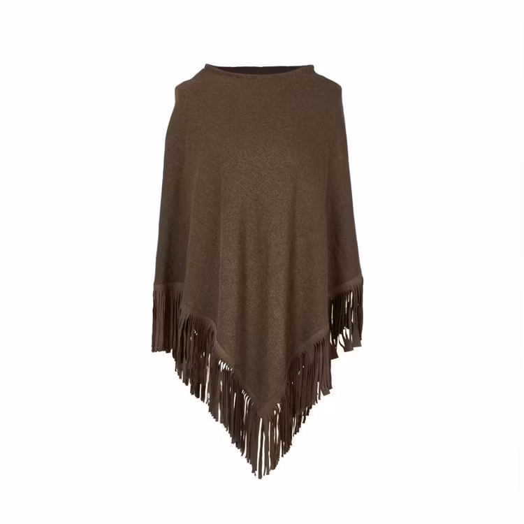 Jackie en poncho i 100% bomull med skinnfransar i one size. Färg: Brun.