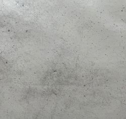 Sten är en rund vaxduk från Noble house. Färg: Betongfärgad.