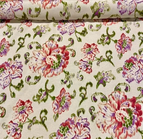 Noha en metervara i ljus linnefärgad botten med ett blommönster
