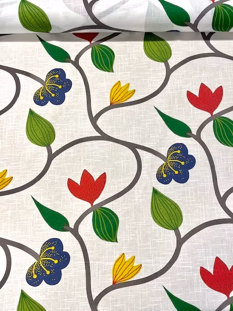 Blomslinga en metervara på vit botten med ett blommönster i grönt, rött, gult och blått