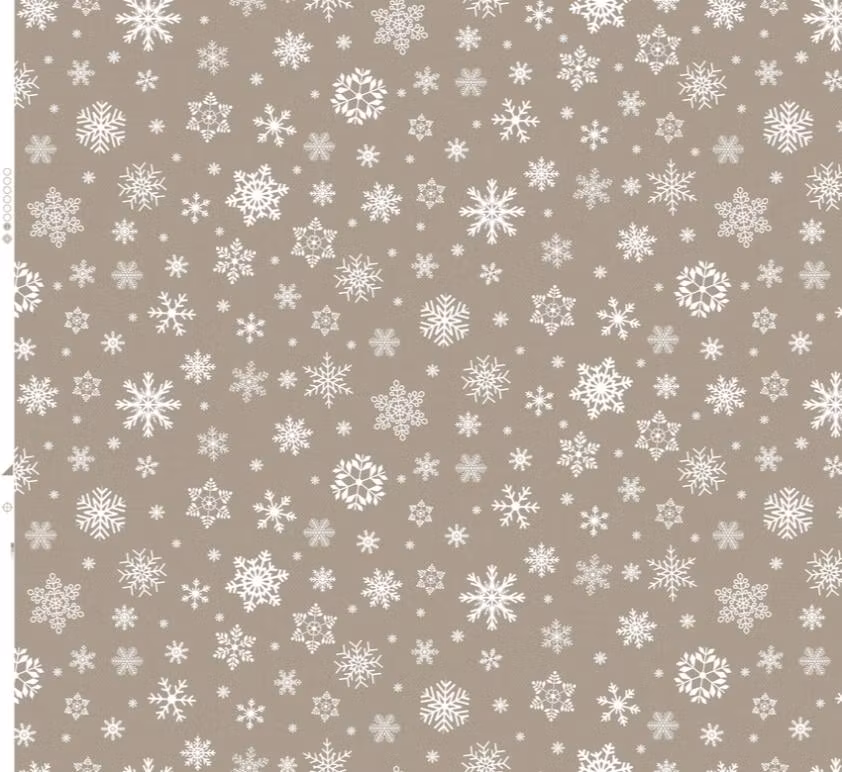 Snöflingor en beige vaxduk med vita snöflingor i bredd 140 cm från Franzens textil