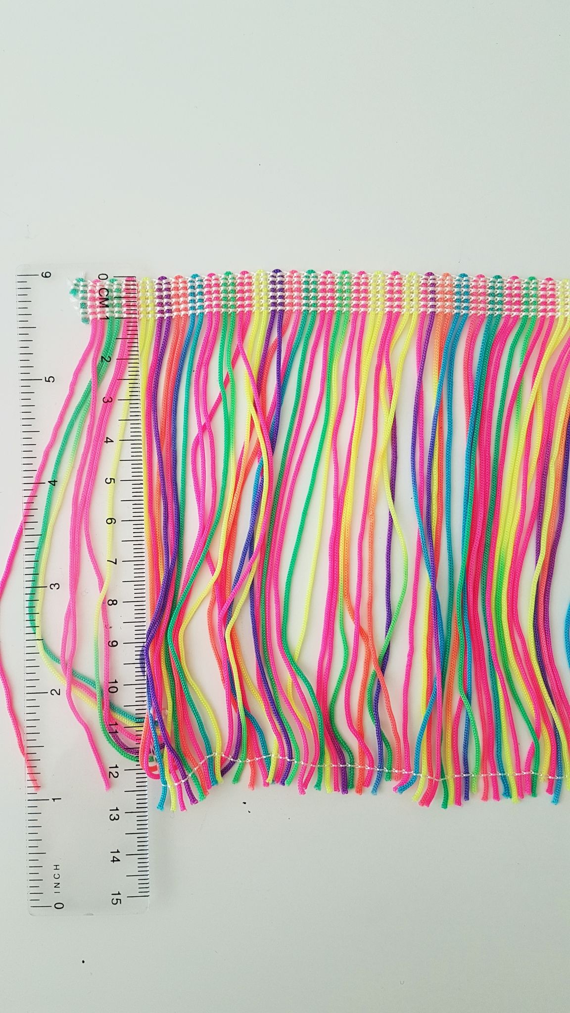 Bård med frans textil