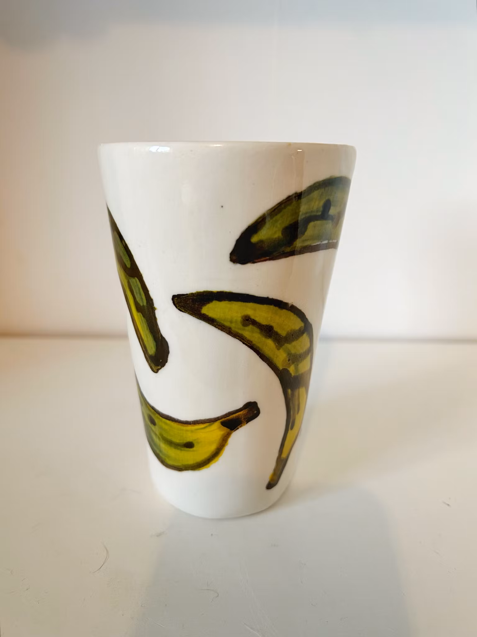 Hög kopp grön banan
