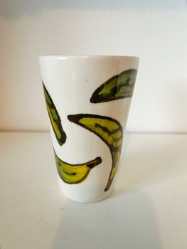 Hög kopp grön banan