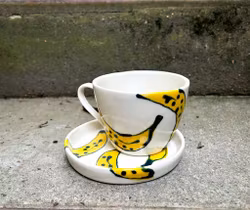 Kopp med fat gul banan