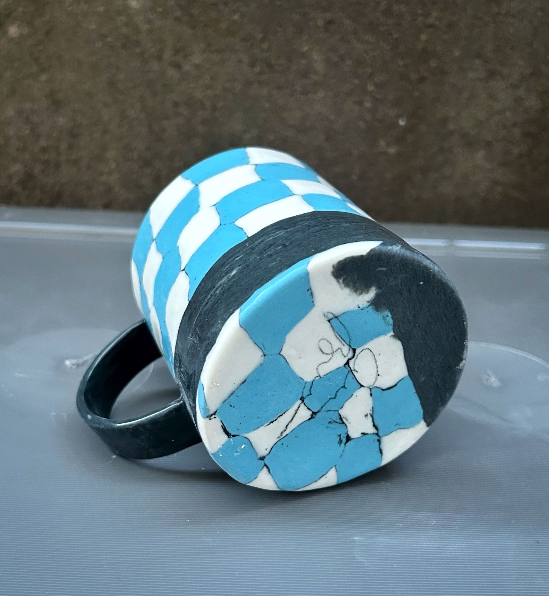 Rutig kopp svart handtag