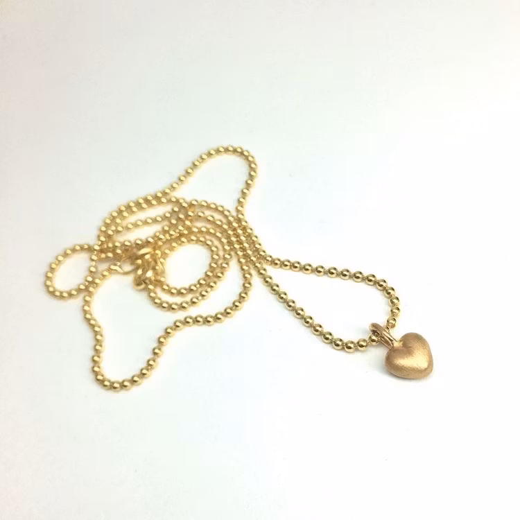 Tiny Heart - minihänge i 18K guld