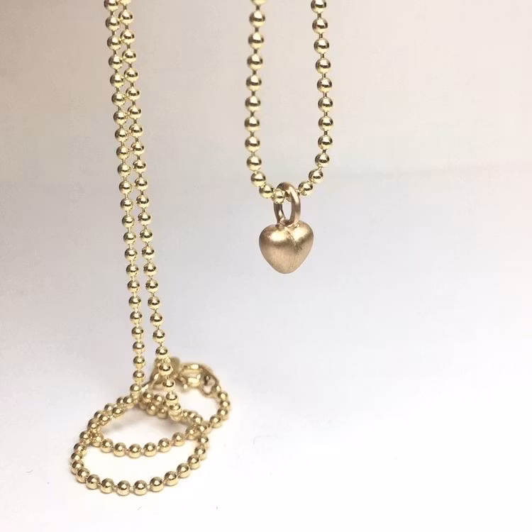 Tiny Heart - minihänge i 18K guld