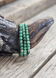 Buddstone, armband 6mm runda pärlor