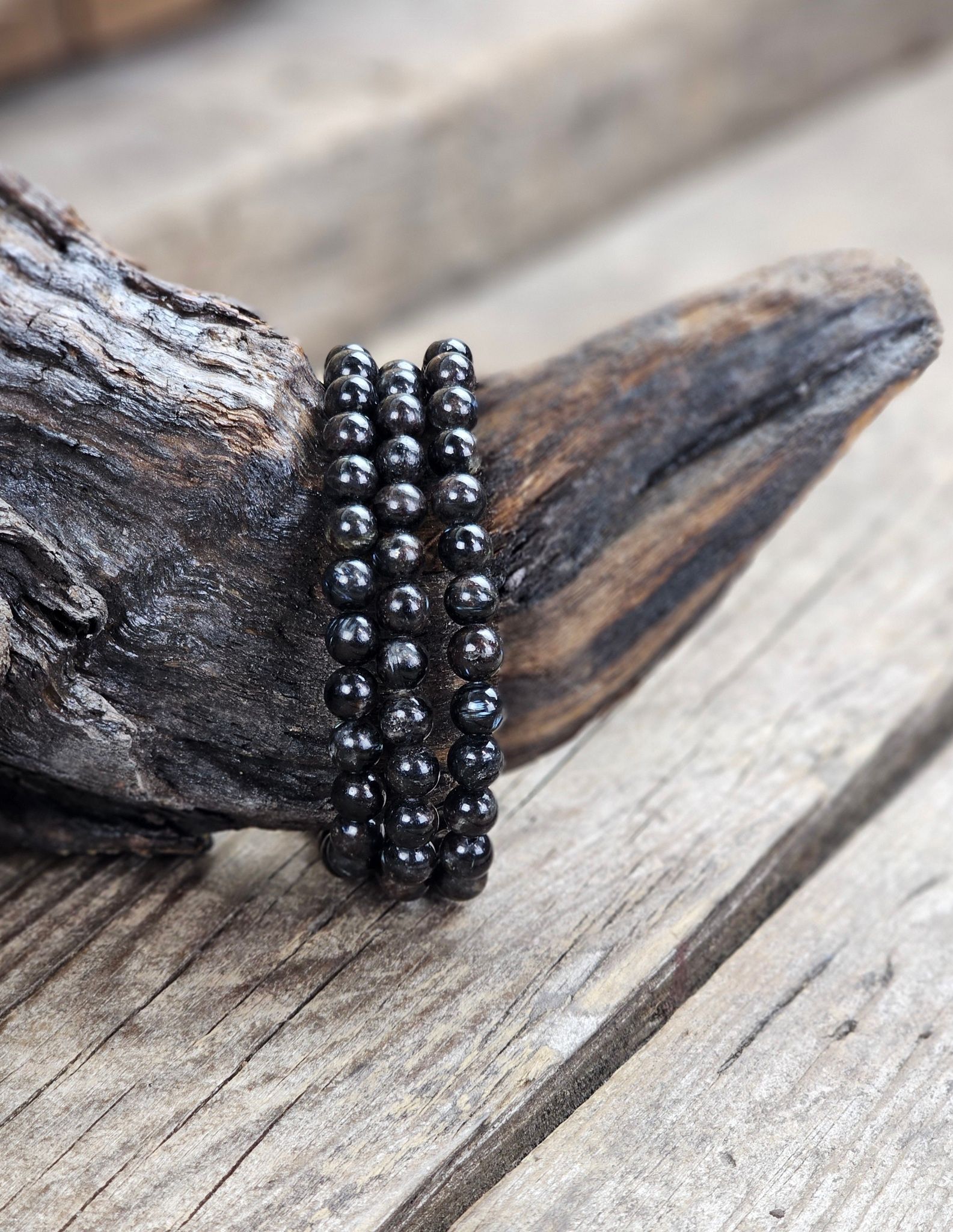 Astrofyllit, armband 6mm runda pärlor