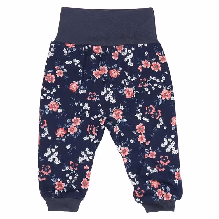 Marinblå byxa med blommigt mönster och mudd i midja och benslut från kollektionen Blommor.
