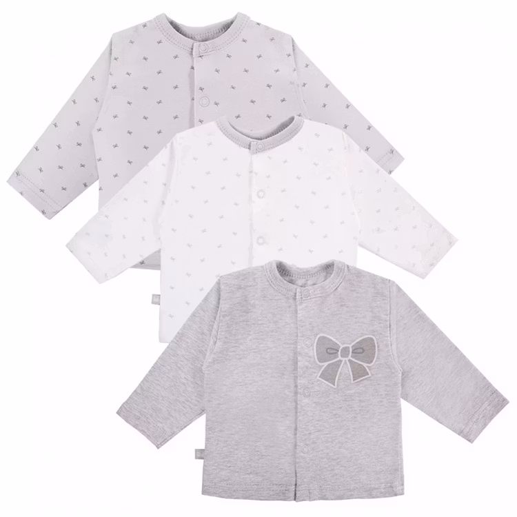 Tre långärmade grå tröjor med rosettmotiv och rosettmönster från kollektionen Tiny Bow