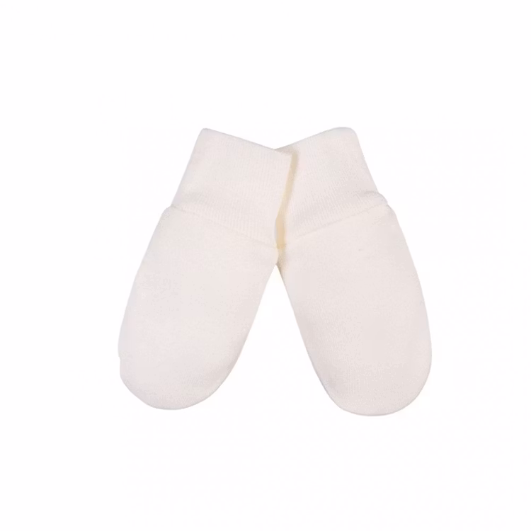 Beige pastellfärgade vantar från kollektionen Classic Pastel.  Vantarna har mudd vid handleden.