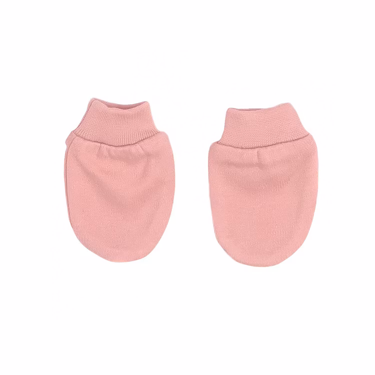 Rosa vantar från kollektionen Bow. Vantarna har mudd vid handleden.