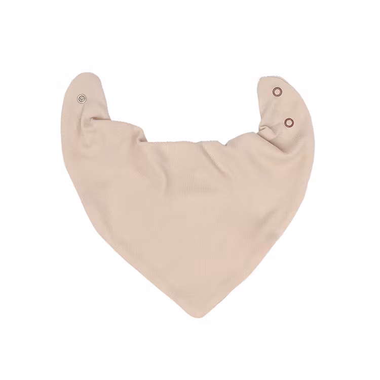 Beige dregglis från kollektionen Tiger. Dregglisen har tryckknappar i kragen.