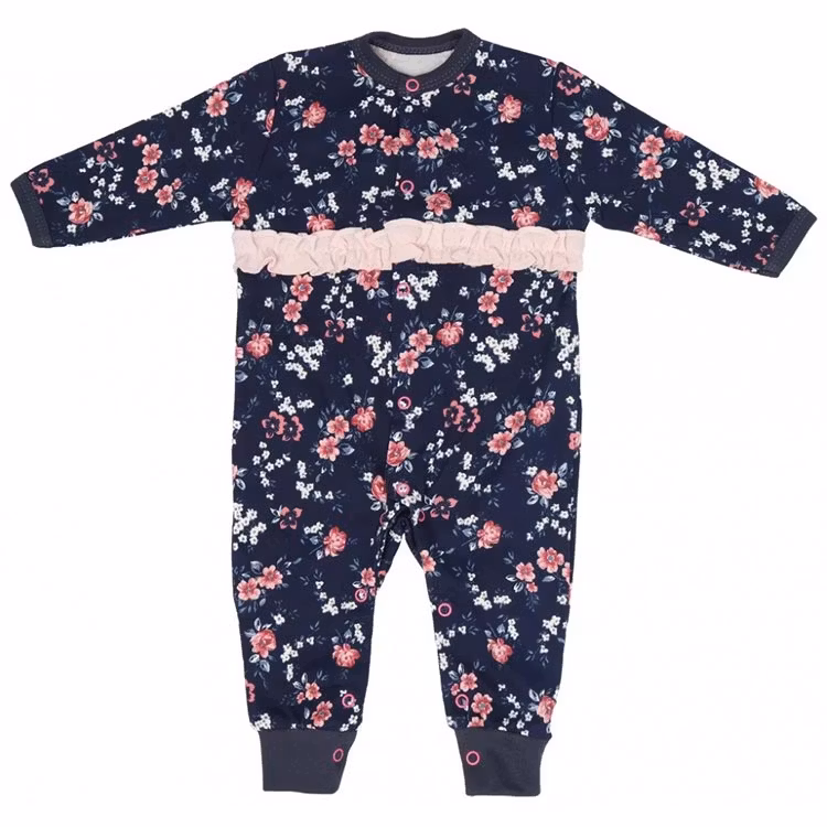 Långärmad jumpsuit med blommigt mönster och volang