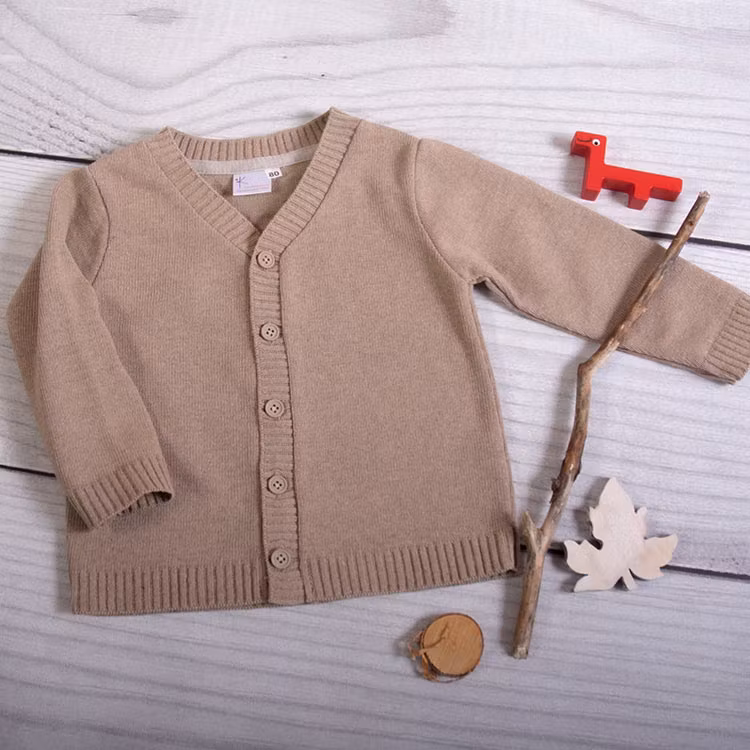 Beige kofta från kollektionen Baby Elegance