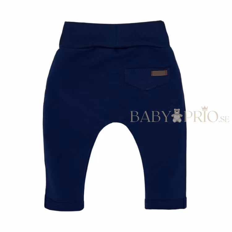 Baksida av eleganta marinblå sweatpants med fickor - Ellegance