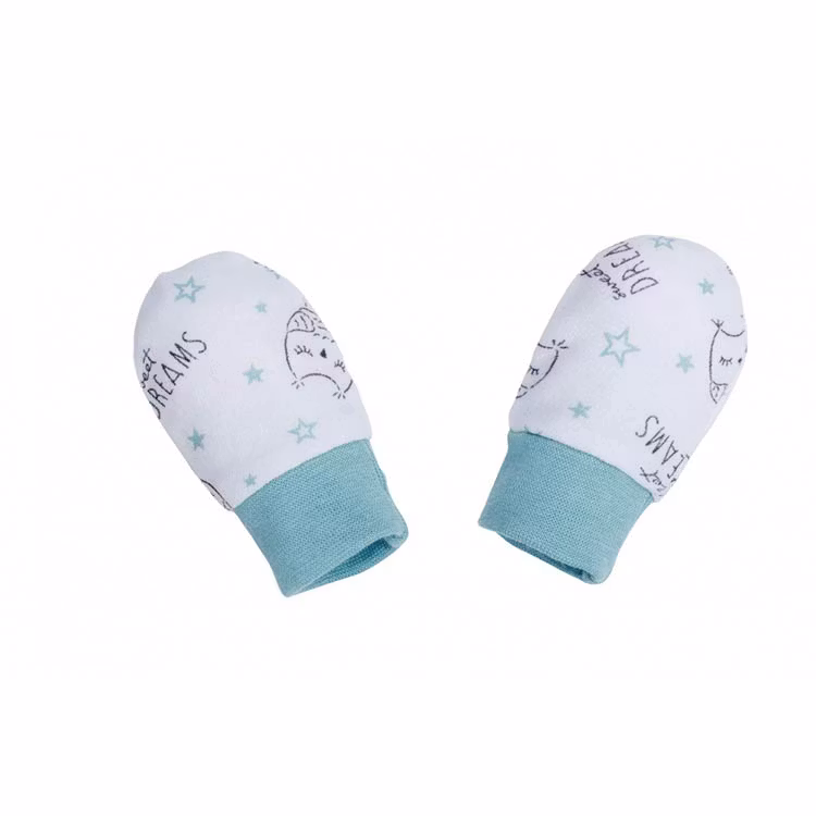 Vit-turkosa vantar med ugglor från kollektionen Sweet Dreams. Vantarna har mudd vid handleden.