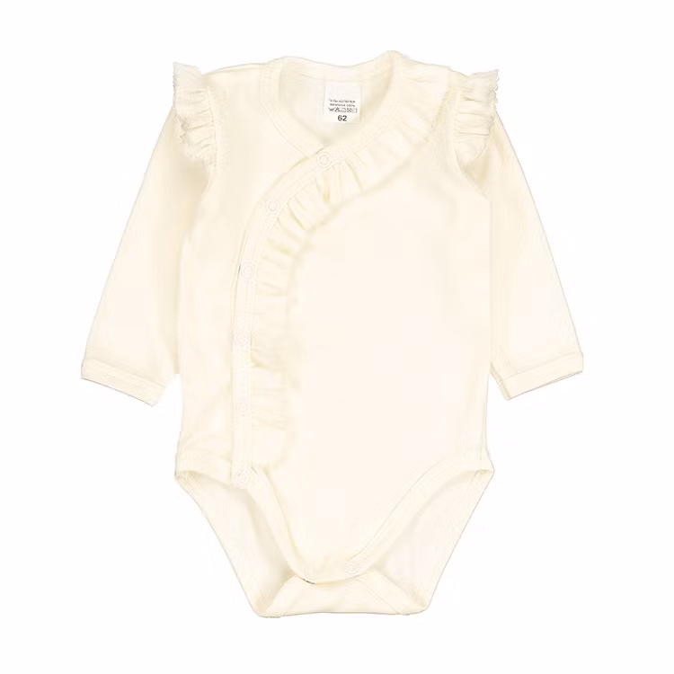 Cremevit body med volang - Elle