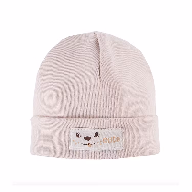 Ribbstickad mössa - Beige
