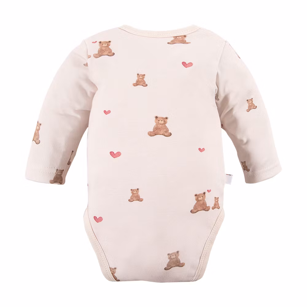 Baksida av Beige body med volang och söta nallar