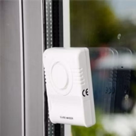 Glaskrosslarm för fönsterrutor med varningsetikett