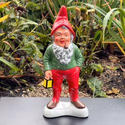 Elderly Santa with pipe and lantern