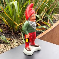 Elderly Santa with pipe and lantern