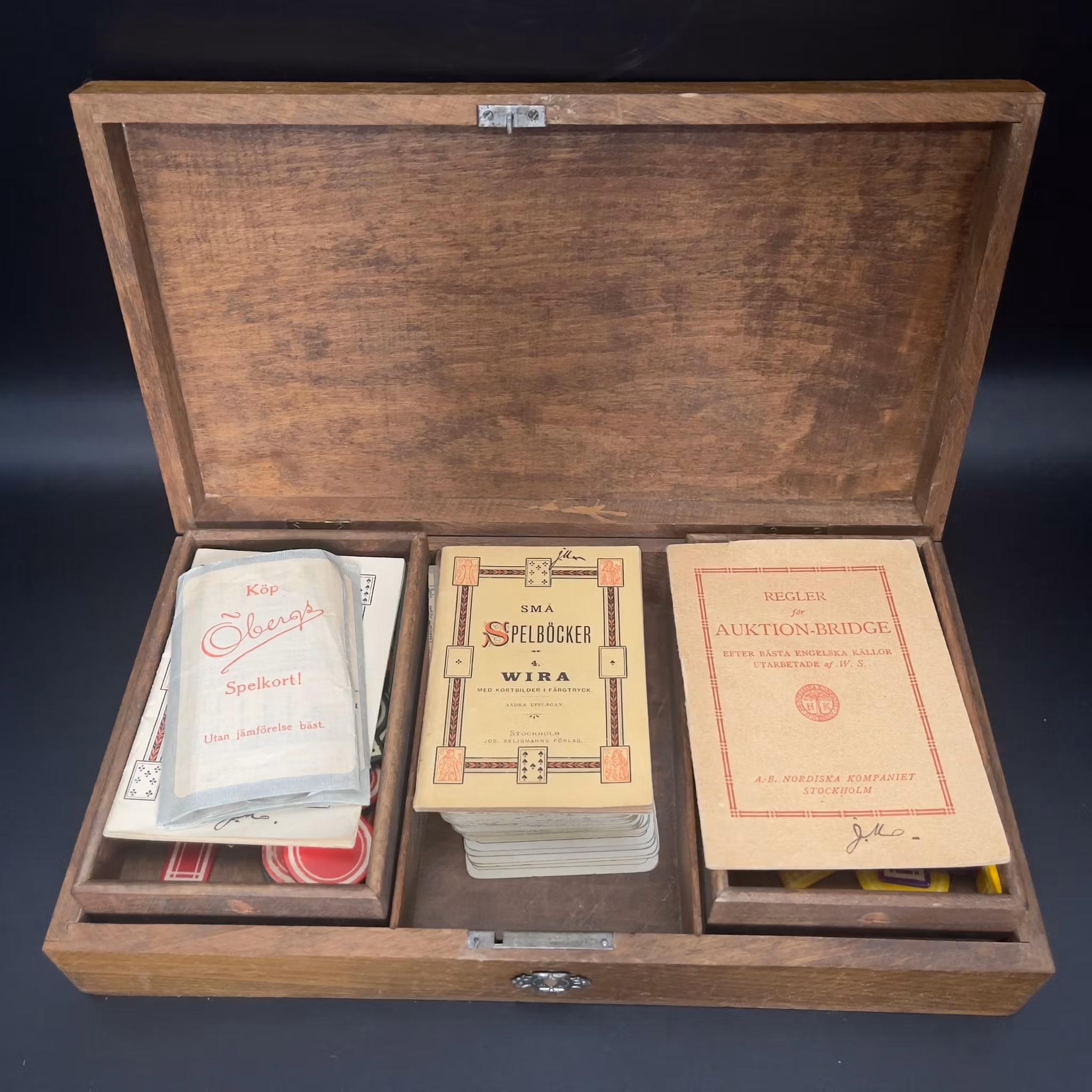 Antique playing card set and chips in wooden box