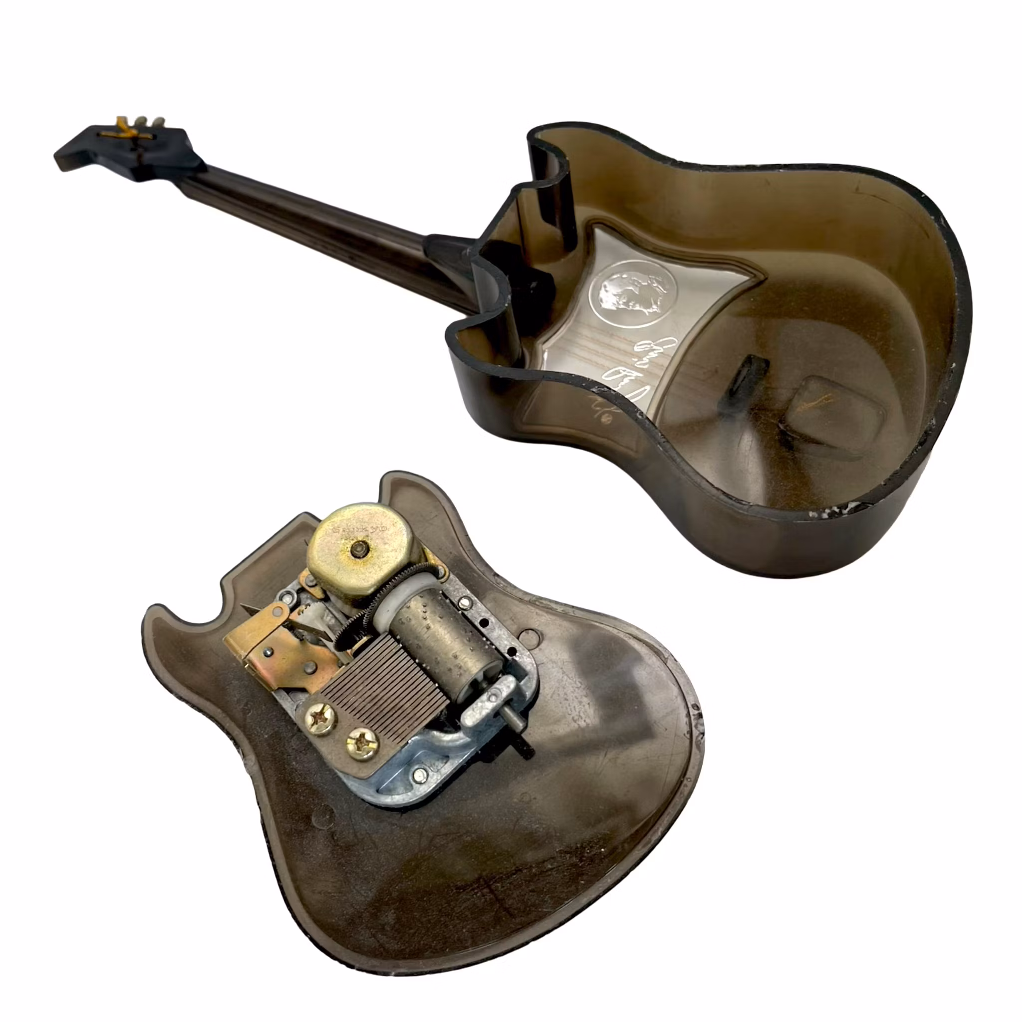 Elvis sin gitarformede musikkboks – snurrer og spiller sangen Love Me Tender