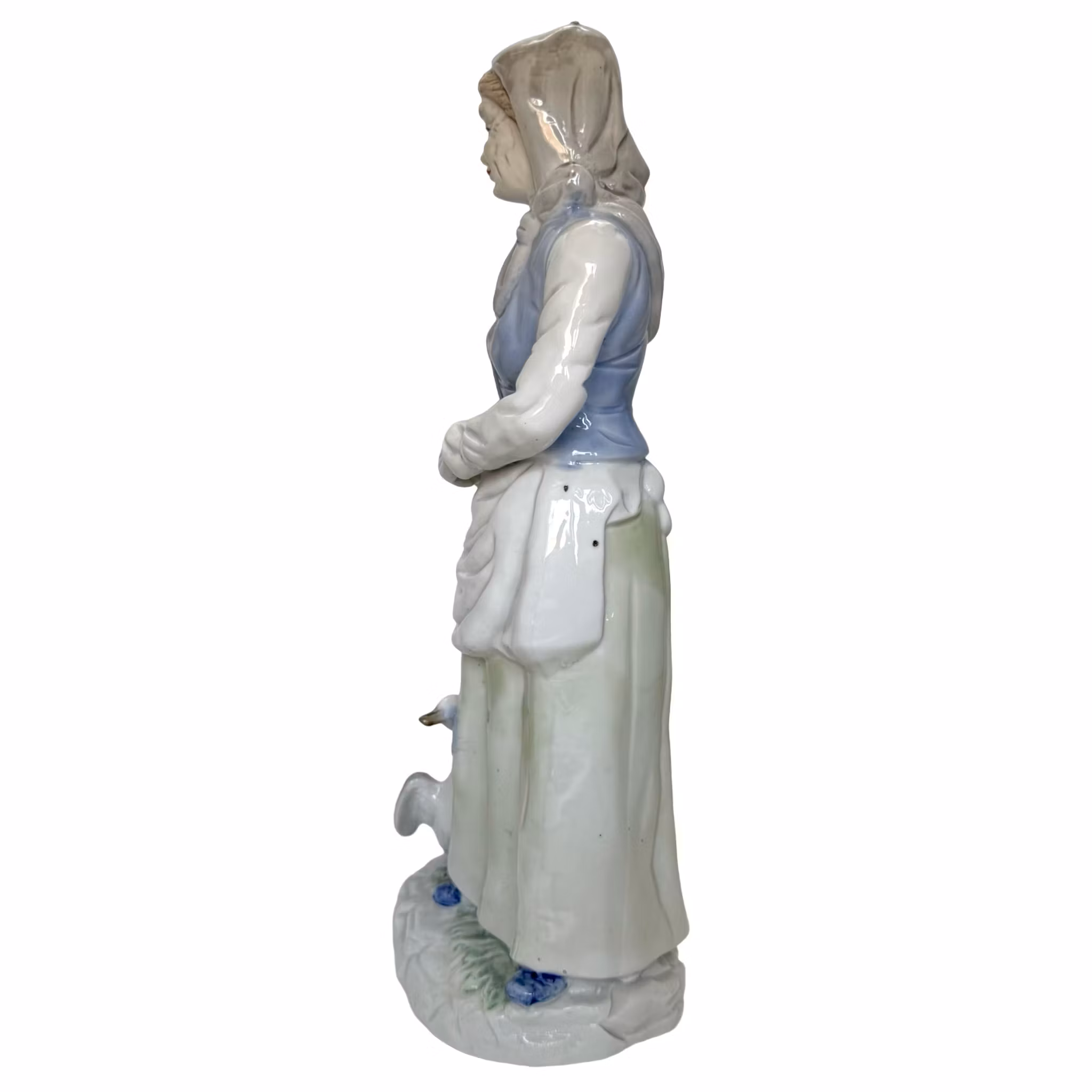 Figurine, girl with goose and fish in basket, porcelain