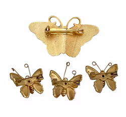 4 SPILLE a forma di farfalla con decorazione in smalto.