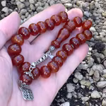 Vackert vintage radband i röd bakelit - 21 pärlor - 45 g