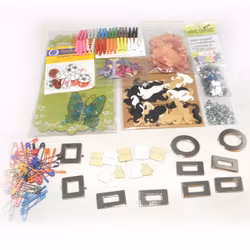 ca 12 paket med dekorationer, nitar, knappar, mm till scrapbooking/egna kort mm