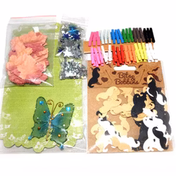 ca 12 paket med dekorationer, nitar, knappar, mm till scrapbooking/egna kort mm