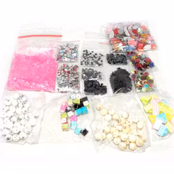 Paket med glitter, rhinestones, paljetter och akrylpärlor