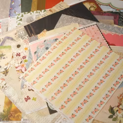 Scrapbookingspapper - ca 20 - 30 cm - ca 50 st - blommor, blad, fjärilar, julmotiv, mm